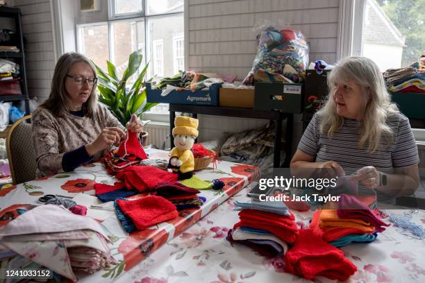 Caroline Topping and Julie Bartram crochet and knit bunting at the Beccles Community Hub on June 1, 2022 in Beccles, England. The people of Beccles,...