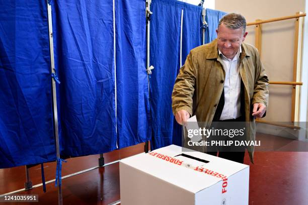Former Danish prime minister and leader of the liberal Moderates Party Lars Loekke Rasmussen casts his vote at a polling station at Nyboder School in...