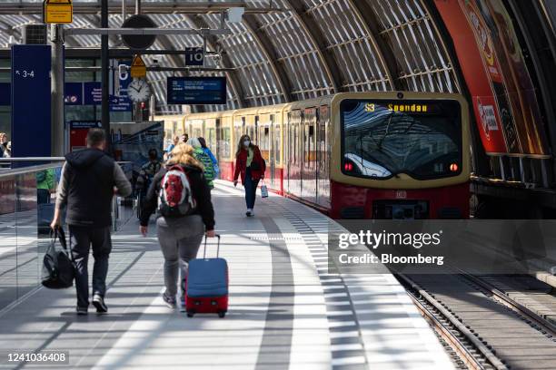 Passengers pass an S-Bahn train, operated by S-Bhan Berlin Gmbh, on a platform in at Berlin Central Station in Berlin, Germany, on Wednesday, June 1,...