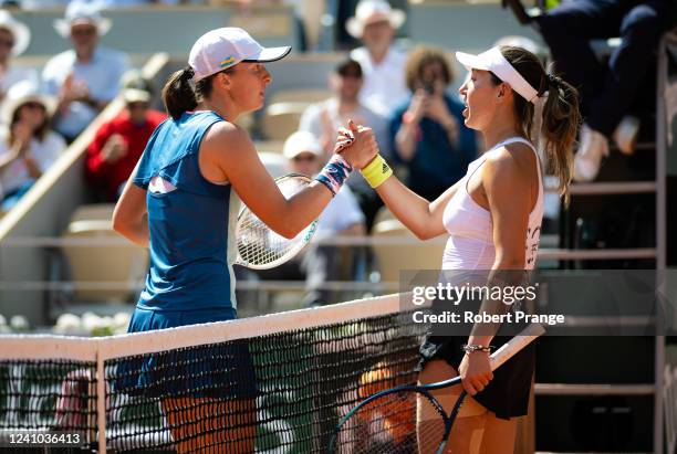 Iga Swiatek of Poland and Jessica Pegula of the United States shake hands at the net after their quarter-final match on Day 11 at Roland Garros on...