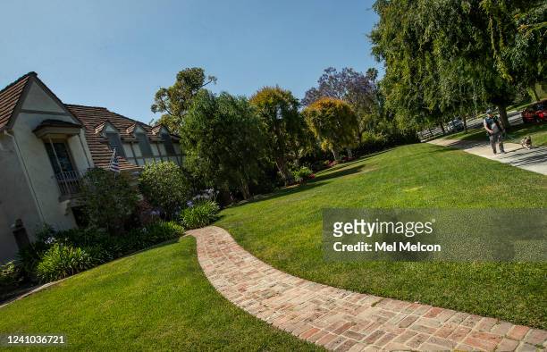 Overall, shows the green front lawn of a home on Elm Dr. In Beverly Hills. Its going to be a summer of brown grass and hard choices for Southern...