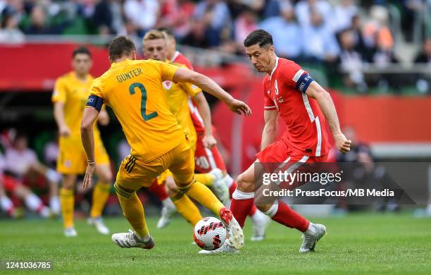 Chris Gunter of Wales tackles Robert Lewandowski of Poland during the UEFA Nations League League A Group 4 match between Poland and Wales at...