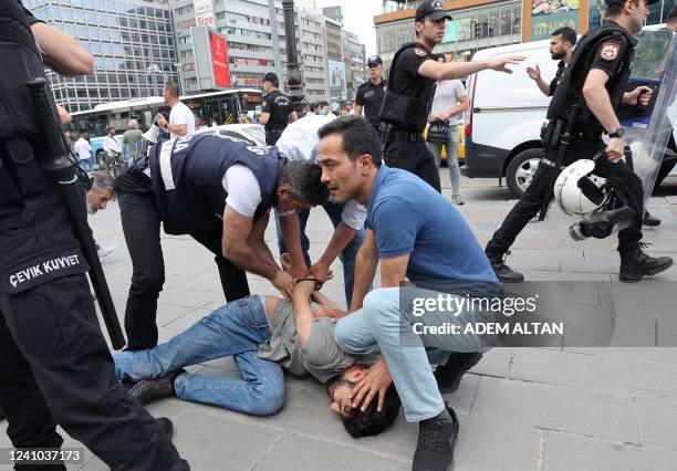 Police detain a protester during a gathering in memory of Ethem Sarisuluk, a 26-year old Turkish man killed by a riot police officer in June 2013...