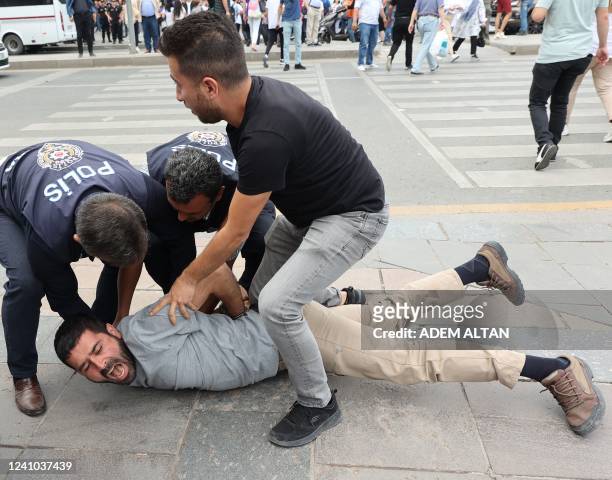 Police detain a protester during a gathering in memory of Ethem Sarisuluk, a 26-year old Turkish man killed by a riot police officer in June 2013...