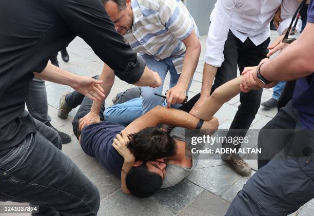 Police members detain protesters during a gathering in memory of Ethem Sarisuluk, a 26-year old Turkish man killed by a riot police officer in June...