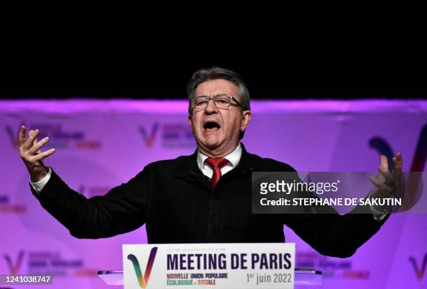 Nupes leader Jean-Luc Melenchon of the LFI leftist party gestures as he delivers a speech during a political meeting of French left-wing electoral...