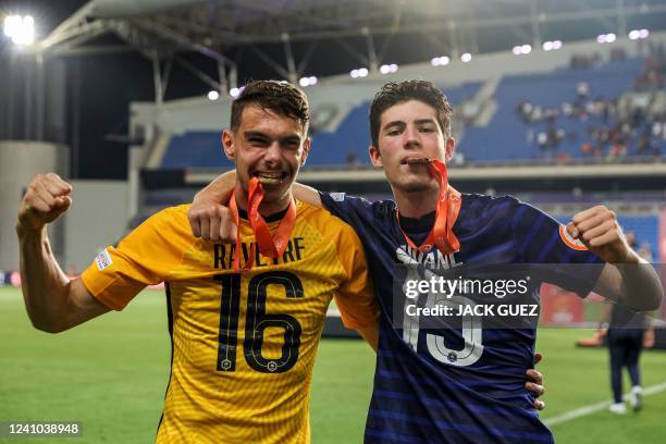 France's goalkeeper Noah Raveyre and France's defender Elyaz Zidane celebrate with their medals after winning the 2022 UEFA European Under-17...