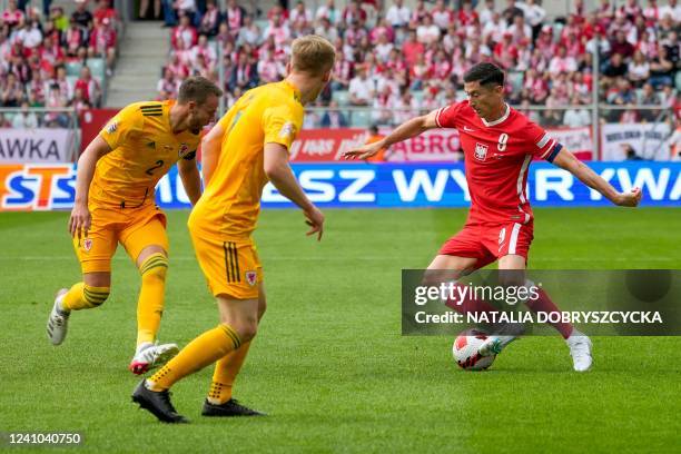 Poland's forward Robert Lewandowski and Wales' defender Chris Gunter vie for the ball during the UEFA Nations League - League A Group A4 football...