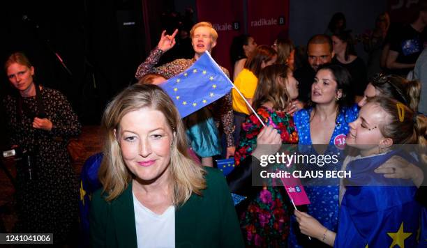 Leader of the Social Liberal Party Sofie Carsten Nielsen is being interviewed while party members celebrate the initial results in Copenhagen,...