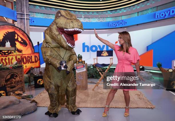 Rexy and Adamari Lopez are seen on the set of Telemundo's "Hoy Dia" morning show promoting the movie "Jurassic World: Dominion" on June 1, 2022 in...