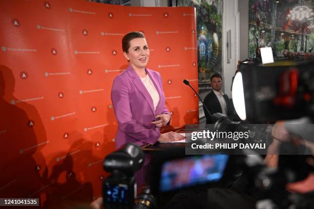 Danish Prime Minister and Chairwoman of The Social Democratic Party Mette Frederiksen reacts as she speaks to members of her party and journalists at...