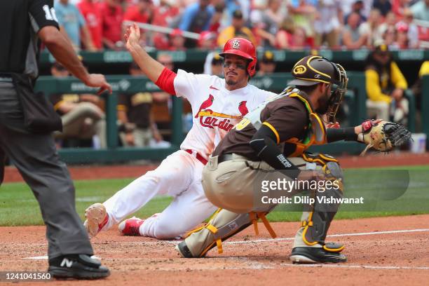 Nolan Arenado of the St. Louis Cardinals scores a run against Austin Nola of the San Diego Padres in the eighth inning at Busch Stadium on June 1,...