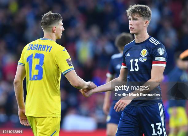 Jack Hendry of Scotland and Illia Zabarnyi of Ukraine shake handsat the final whistle during the FIFA World Cup Qualifier between Scotland and...