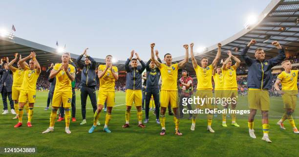 The players of the Ukraine celebrate after winning the FIFA World Cup Qualifier match between Scotland and Ukraine at Hampden Park on June 1, 2022 in...