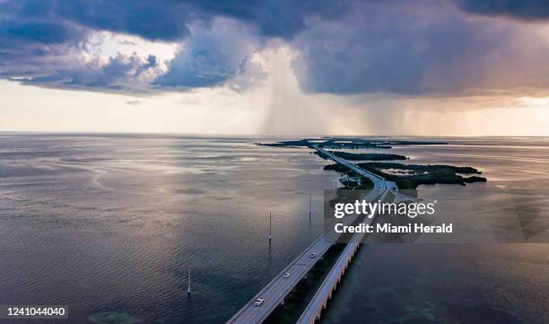 Cars make their way down the Overseas Highways Seven Mile Bridge near Little Duck Key and Bahia Honda State Park on Oct. 11, 2021. A person died in a...