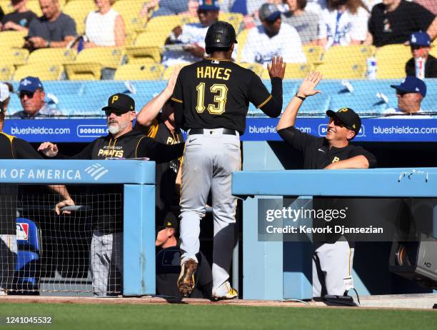 Ke'Bryan Hayes of the Pittsburgh Pirates is congratulated after scoring a run against the Los Angeles Dodgers in the first inning at Dodger Stadium...