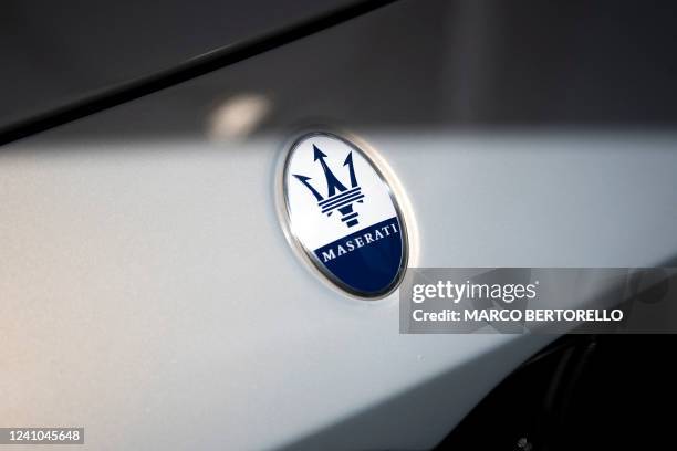 The logo of Italian manufacturer of luxury sports cars Maserati is pictured on a car in Modena, Northern Italy, during the Motor Valley Fest, the...