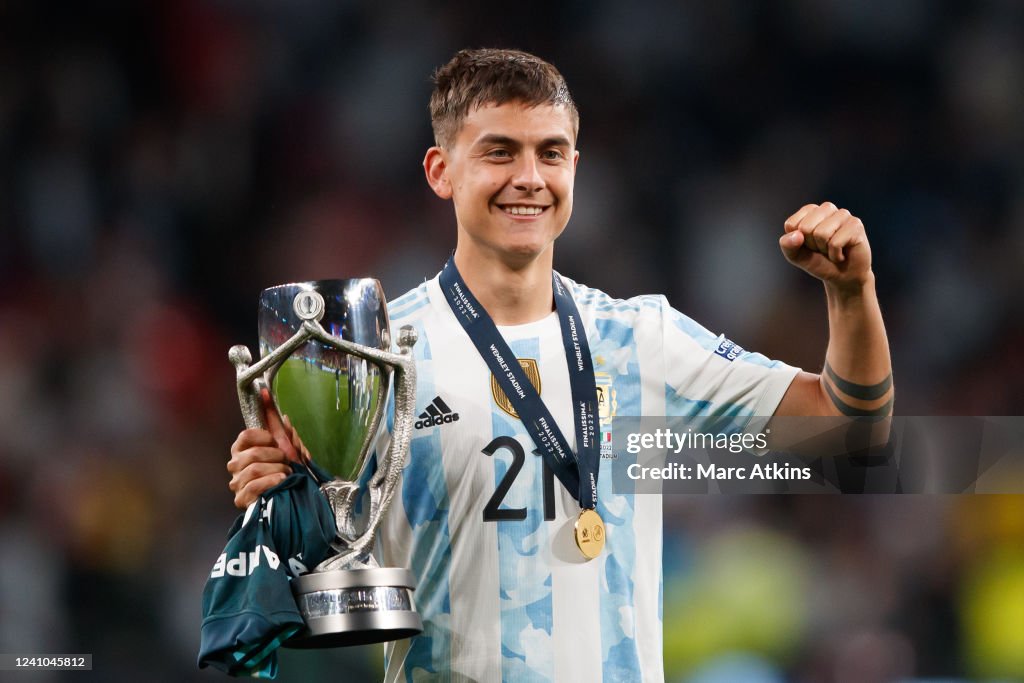 Paulo Dybala of Argentina poses with the trophy and his winners medal ...