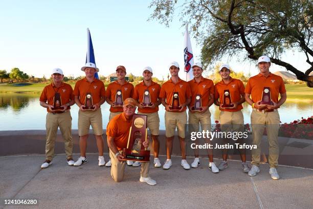 The Texas Longhorns celebrates with the trophy after defeating the of the Arizona State Sun Devils to win the Division I Mens Golf Championship held...