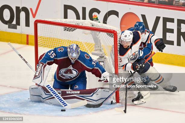 Colorado Avalanche goaltender Darcy Kuemper makes a save against a wraparound shot attempt by Edmonton Oilers left wing Zach Hyman in the first...