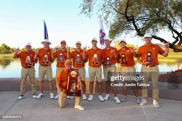 The Texas Longhorns celebrates with the trophy after defeating the of the Arizona State Sun Devils to win the Division I Mens Golf Championship held...
