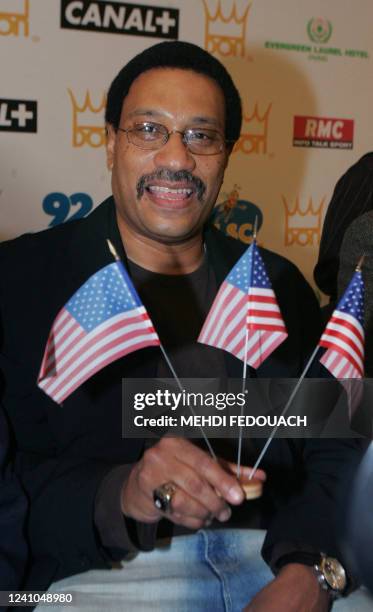 Boxing promoter Carl King poses with his national flags during a press conference in the Parisian suburb Levallois-Perret, 07 November 2007. M'Baye...