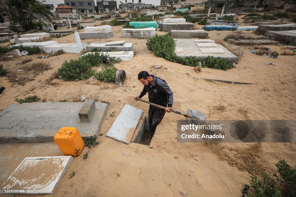 Palestinian youth completes master's degree with earnings from grave digging