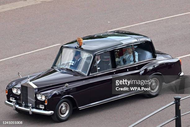 Camilla, Duchess of Cornwall, is seen in the rear of a car as she is driven along the Mall towards Buckingham Palace for the Trooping the Colour...