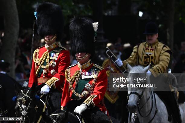 Britain's Prince Charles , Prince of Wales in his role as Colonel of the Welsh Guards, Britain's Prince William , Duke of Cambridge, in his role as...