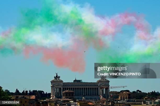 Picture taken on June 2 Italian Repubblic Day, shows smoke with the colors of the Italian flag spread by planes of the Italian Air Force aerobatic...