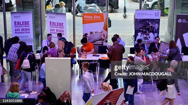 Refugees from Ukraine attend a job fair for Ukrainians organised by the Chamber of Industry and Commerce in Berlin on June 2, 2022.