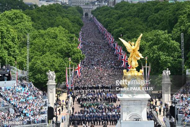 Members of the public fill The Mall ahead of a fly-past over Buckingham Palace, during the Queen's Birthday Parade, the Trooping the Colour, as part...