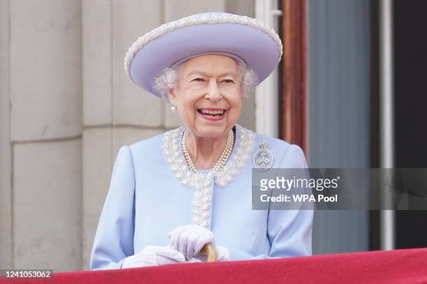Queen Elizabeth II watches from the balcony of Buckingham Palace during the Trooping the Colour parade the Trooping the Colour parade on June 2, 2022...