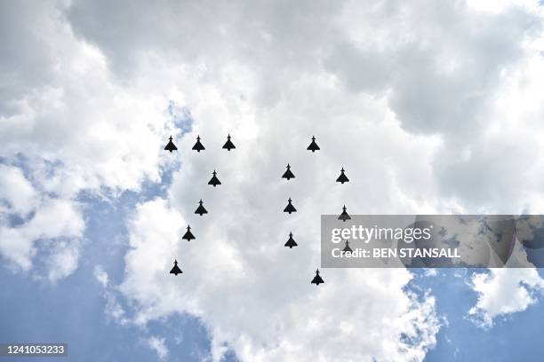 Fighter jets from Britain's RAF fly in formation to form the number '70' duing a special flypast from Buckingham Palace balcony following the Queen's...