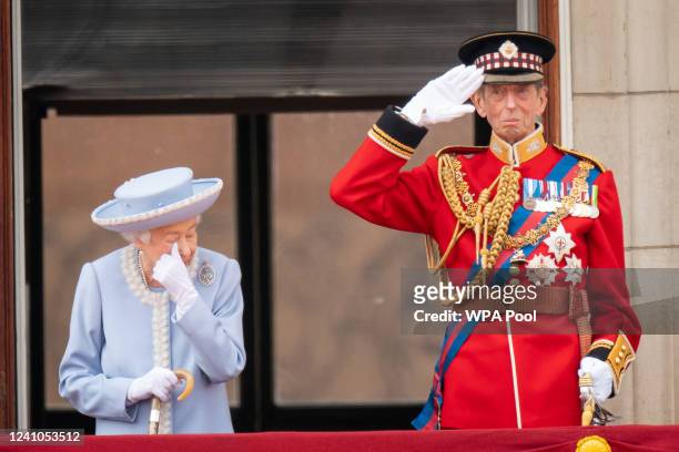 Queen Elizabeth II and Prince Edward, Duke of Kent watch from the balcony at Buckingham Palace for the Trooping the Colour ceremony parade on June 2,...