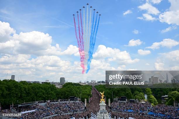 The Royal Air Force Aerobatic Team, the Red Arrows, fly in formation duing a special flypast from Buckingham Palace balcony following the Queen's...