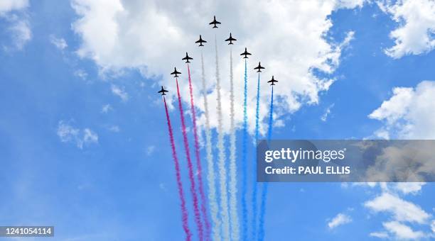 The Royal Air Force Aerobatic Team, the Red Arrows, fly in formation during a special flypast from Buckingham Palace balcony following the Queen's...