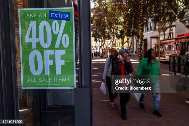 Sale sign in the window of a store in San Francisco, California, US, on Wednesday, June 1, 2022. US consumer confidence dropped in May to the lowest...