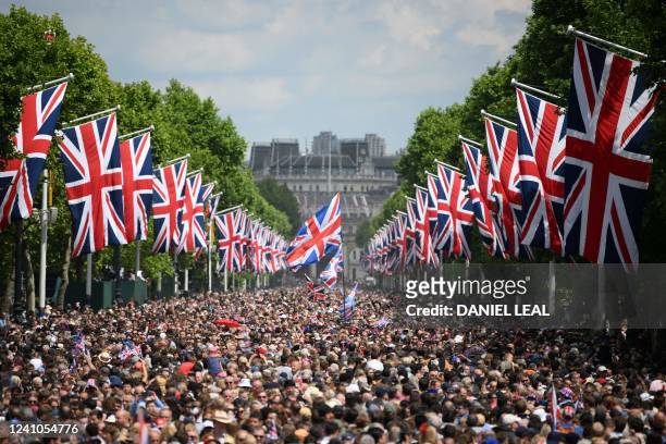 Members of the public fill The Mall before a flypast during the Queen's Birthday Parade, the Trooping the Colour, as part of Queen Elizabeth II's...