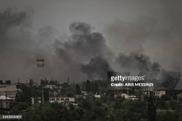 Smoke and dirt rise in the city of Severodonetsk during fighting between Ukrainian and Russian troops at the eastern Ukrainian region of Donbas on...