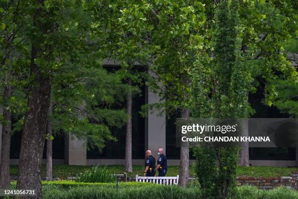 Police officers patrol the Natalie Medical Building at Saint Francis Hospital campus in Tulsa, Oklahoma, on June 2, 2022. - A gunman has killed at...