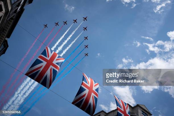 The Red Arrows Aerobatic Team of the Royal Air Force fly over London in a 70 formation after the Trooping of the Colour ceremony that coincided with...