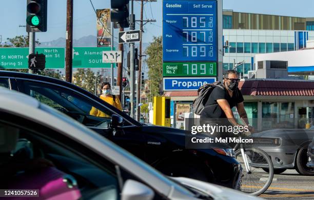 Bicycle rider maneuvers around motorists stuck in traffic on Cesar E. Chavez Ave., at the intersection of Alameda Street in downtown Los Angeles,...