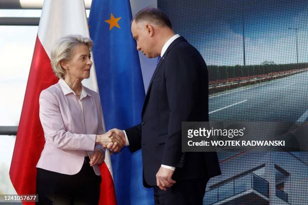 European Commission President Ursula von der Leyen shakes hands with Polish President Andrzej Duda following a joint press conference at the PSE...
