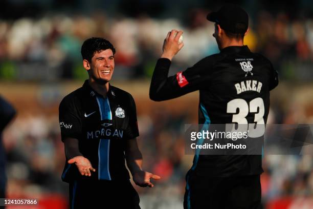 Pat Brown of Worcestershire Rapids celebrates with Josh Baker of Worcestershire Rapids after taking the wicket of Liam Trevaskis of Durham during the...