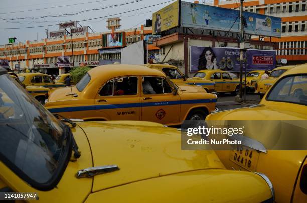 Yellow taxi parking area is seen infront of a railway station in Kolkata, India, 2022.