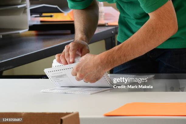 County officials perform a ballot recount on June 2, 2022 in West Chester, Pennsylvania. With less than 1,000 votes separating Republican U.S. Senate...