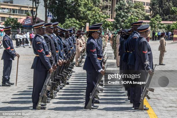 Kenyan police officers are seen in their ceremonial uniforms at a parade during the commemoration of 59th Madaraka Day Celebrations held at Railways...