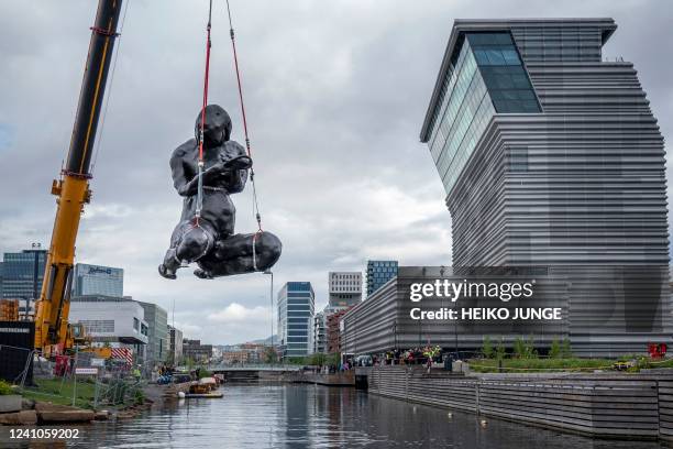 The sculpture 'The Mother' by British artist Tracey Emin is moved by crane to its position outside The Munch Museum in Oslo, Norway, on June 2, 2022....