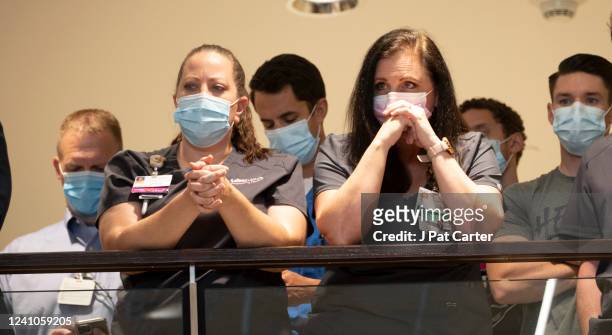 Saint Francis Hospital employees listen to a press conference at St. Francis Hospital on June 2, 2022 in Tulsa, Oklahoma. A gunman killed four people...